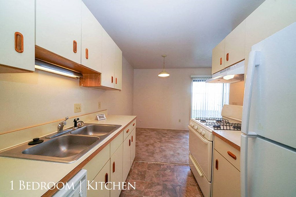 Kitchen With Almond Cabinetry at Mount Royal Townhomes, Michigan, 49009