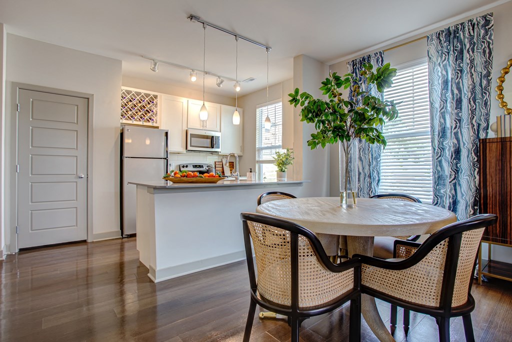 a kitchen and dining room with a table and chairs  at Avellan Springs Apartments, North Carolina, 27560