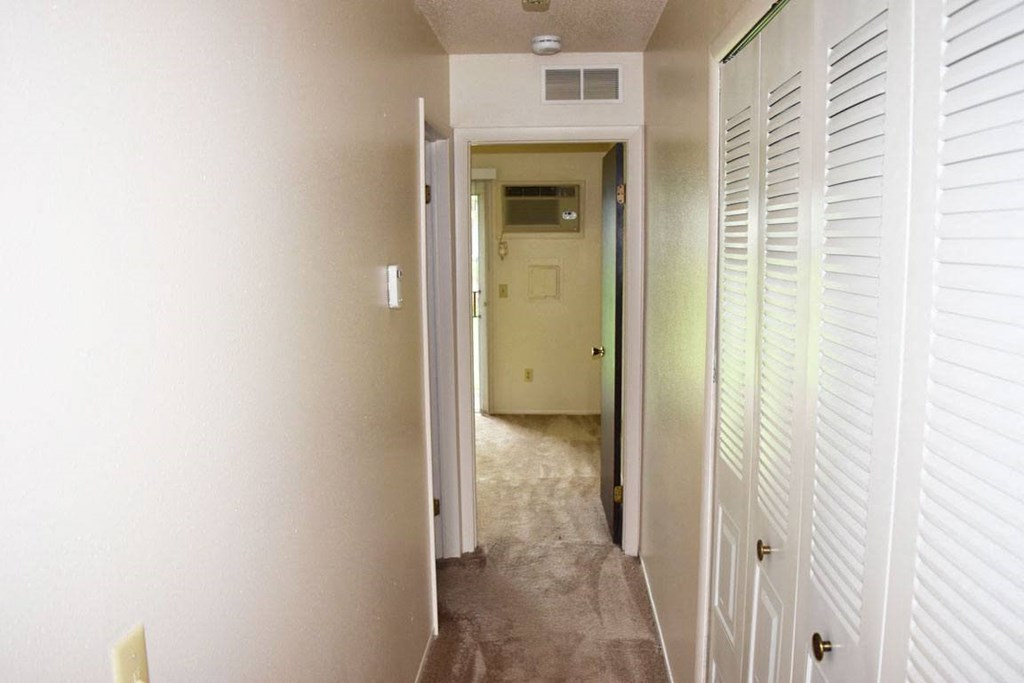 Hallway With Closets at Newport Village Apartments, Portage, Michigan