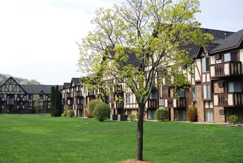 Open Lawns with Lush Landscaping Open Lawns with Lush Landscaping at Normandy Village Apartments, Indiana - Photo Gallery 2