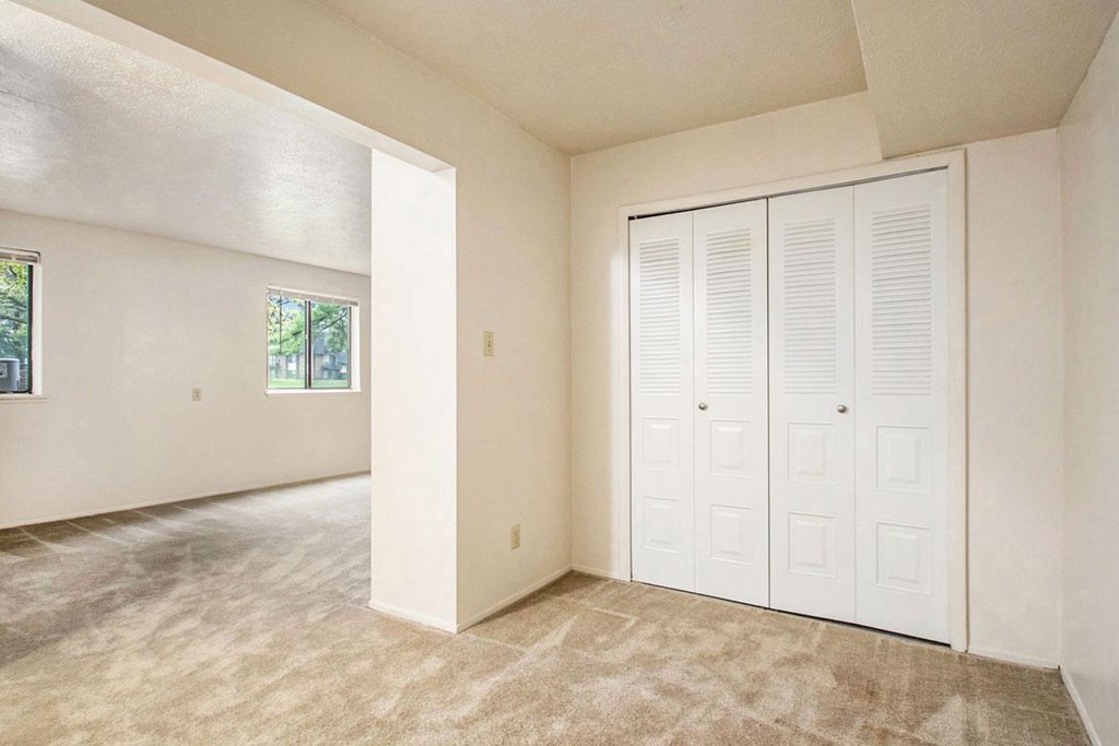 A sleeping area with a large closet at Normandy Village Apartments, Michigan City