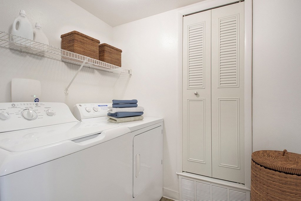 A full size washer and dryer in a laundry room at North Pointe Apartments, Elkhart