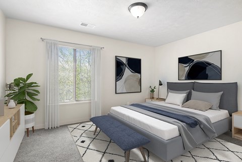 A bedroom with a large bed and a window with curtains at Old Farm Apartments, Elkhart, Indiana