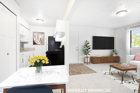 A modern kitchen, dining and living room with a large window at Old Farm Apartments, Elkhart, Indiana