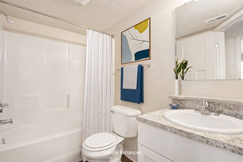 an upgraded bathroom with a sink toilet and a shower at Old Farm Apartments, Elkhart, Indiana