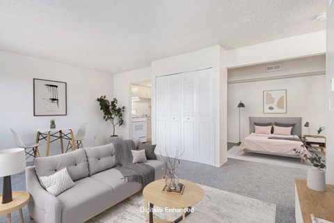 a living room with a couch and a bed at Old Farm Apartments, Elkhart, 46517