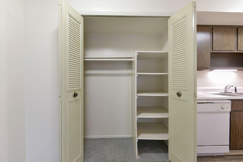 A white closet with shelves at Old Monterey Apartments, Springfield, MO
