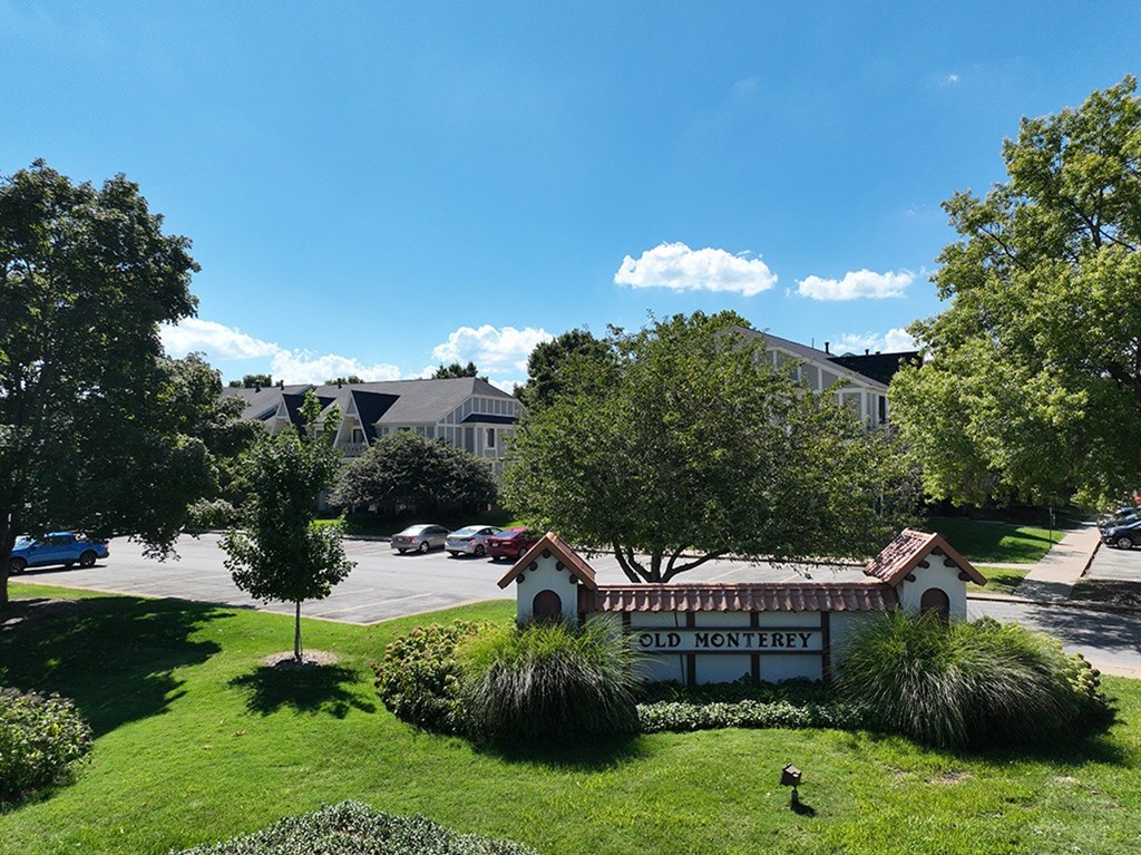 A sign that says Old Monterey in front of a building at Old Monterey Apartments, Springfield, MO