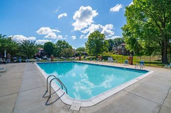 Pool with Large Sundeck at Old Farm Apartments in Elkhart, IN