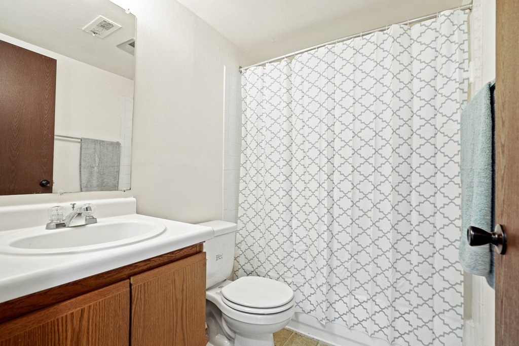 a bathroom with a sink toilet and shower  at Beacon Hill and Great Oaks Apartments, Rockford, Illinois