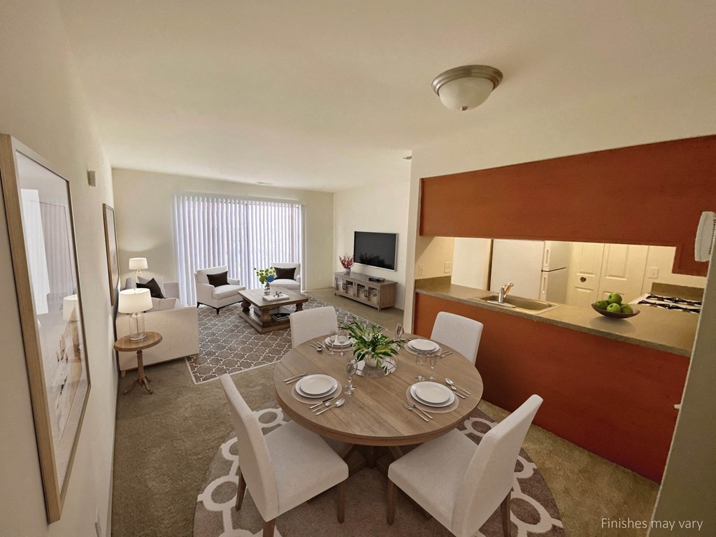 a dining room and living room with a table and chairs at The Landings Apartments, Westland, 48185