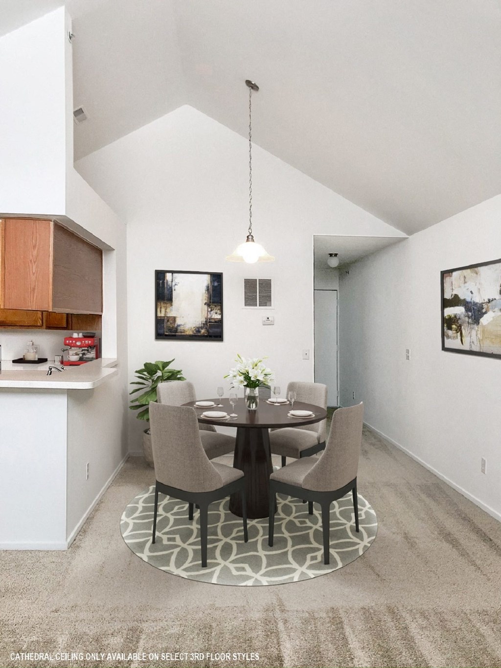 a dining area with a table and chairs and a kitchen in the background  at Northport Apartments, Michigan, 48044