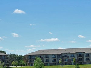 Gated Outdoor Pool and Sundeck Gated Outdoor and Sundeck at Prairie Lakes Apartments, Peoria, IL - Photo Gallery 4