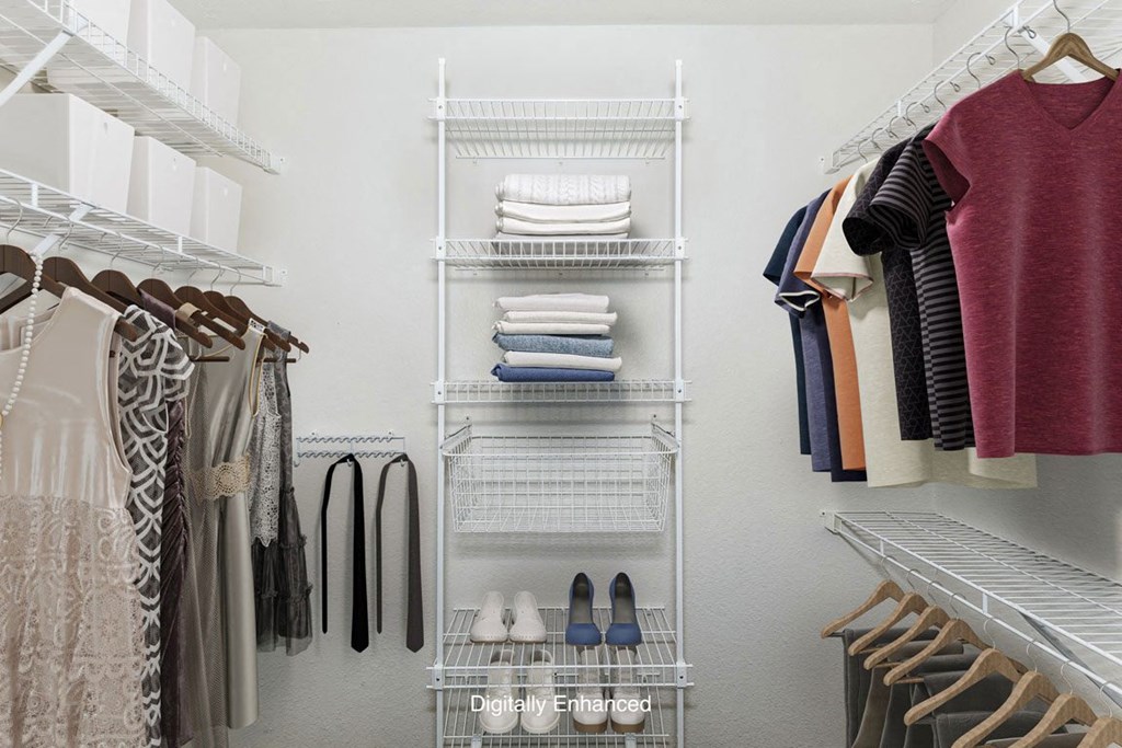 a walk in closet with wardrobe organizers at Stoney Pointe Apartment Homes, Kansas, 67226