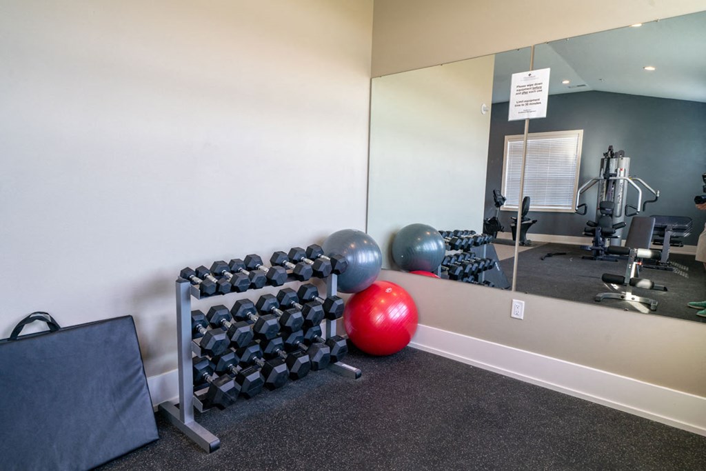 Free Weights In Gym at Strathmore Apartment Homes, West Des Moines, IA