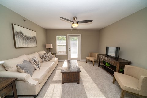 a living room with a couch and a table