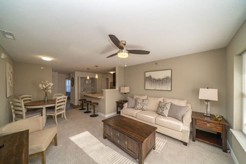Living Room and Kitchen Breakfast Bar at Strathmore Apartment Homes, West Des Moines