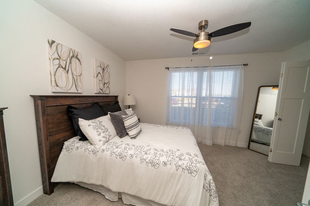 Beautiful bedroom with large windows at Strathmore Apartment Homes, West Des Moines, Iowa