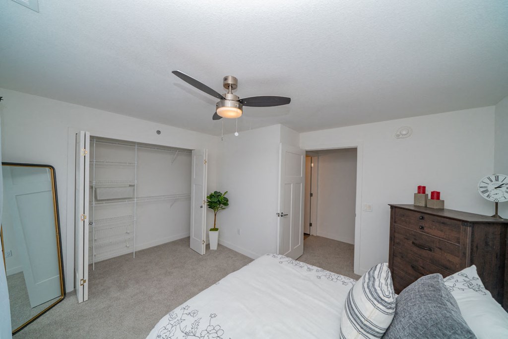 Bedroom with a walk-in closet at Strathmore Apartment Homes, West Des Moines