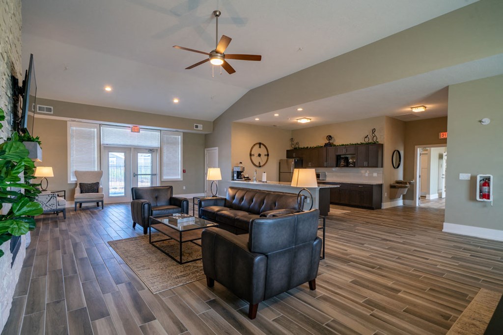 Posh Lounge Area With Fireplace In Clubhouse at Strathmore Apartment Homes, West Des Moines, Iowa