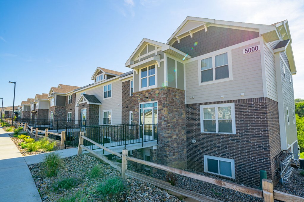 Property exterior building with a fence at Strathmore Apartment Homes, West Des Moines, 50266