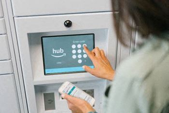 A person using a package pickup service at Strathmore Apartment Homes in West Des Moines, IA