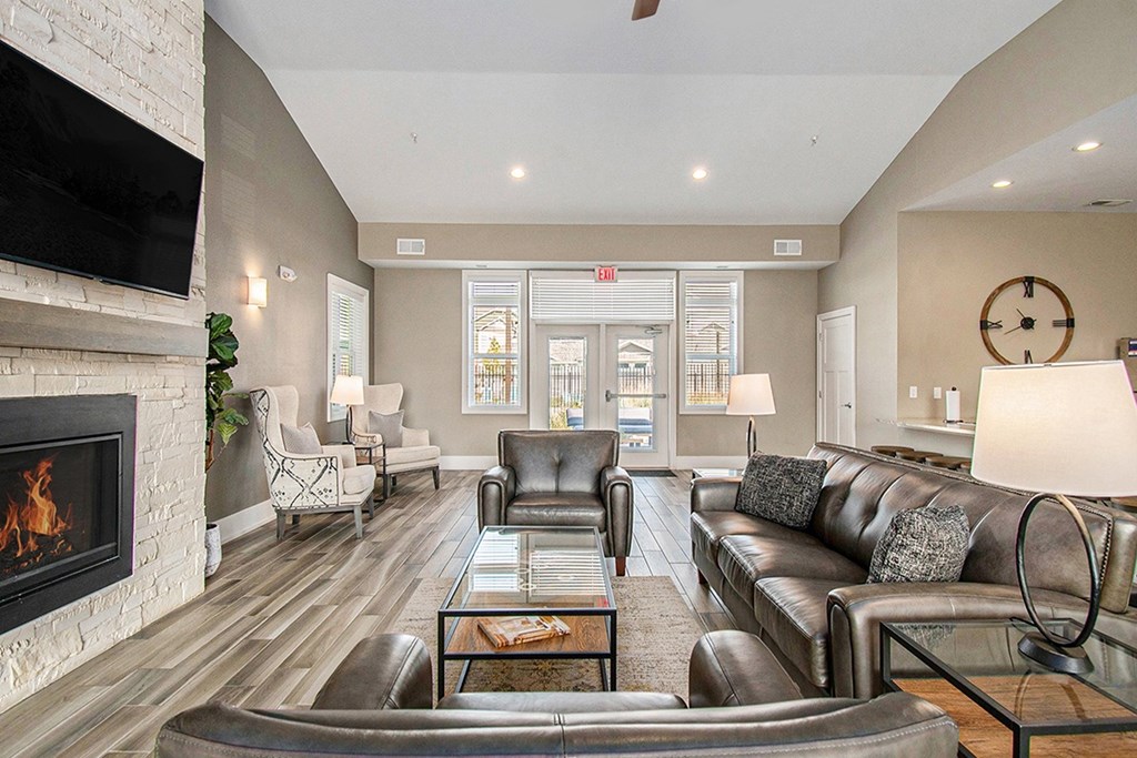 Posh Lounge Area With Fireplace In Clubhouse at Strathmore Apartment Homes, West Des Moines, Iowa