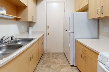 Kitchen with Updated Cabinetry at Swiss Valley Apartments in Wyoming, MI