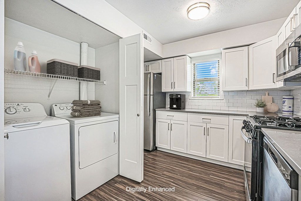 kitchen with white cabinets and stainless steel appliances at The Crossings Apartments, Michigan, 49508
