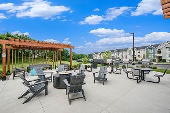 Fire pit with seating at The Crossings Apartments in Grand Rapids, MI