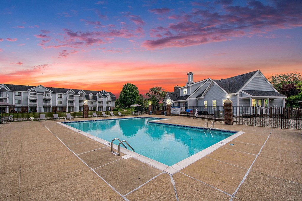 A swimming pool at sunset at The Crossings Apartments, Michigan