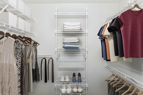 Walk in closet with wardrobe organizers at Tracy Creek Apartment Homes in Perrysburg, OH