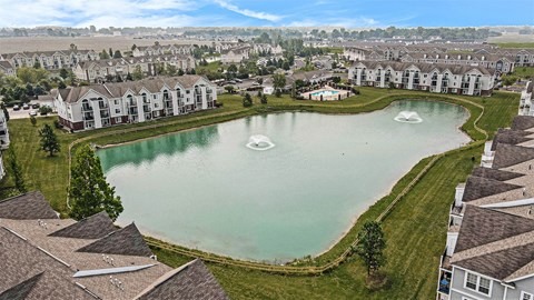 A large pond in the middle of an apartment community at Tracy Creek Apartments, Perrysburg