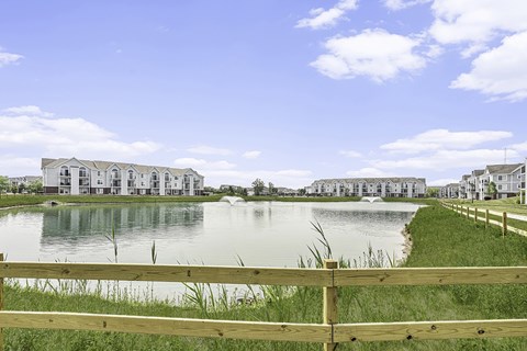A row of apartment buildings are built on a pond at Tracy Creek Apartments, Perrysburg