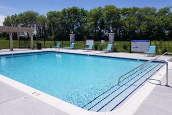 Swimming Pool with Large Sundeck at Trade Winds Apartment Homes in Elkhorn, NE