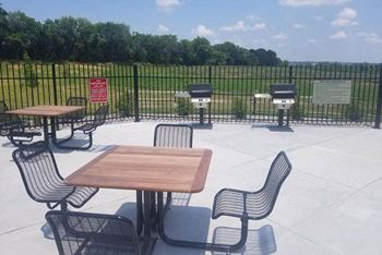 Grilling Area with Seating at Trade Winds Apartment Homes in Elkhorn, NE
