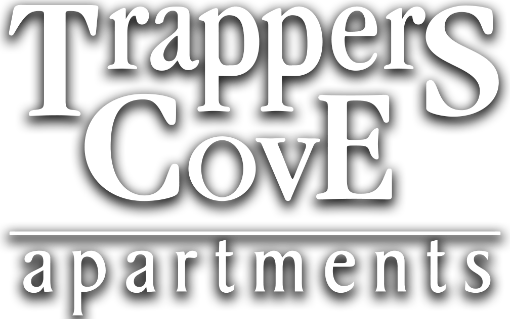 a white logo with the words tapes cove apartments on a black background