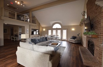 Clubhouse Fireplace Lounge at Trappers Cove Apartments, Michigan
