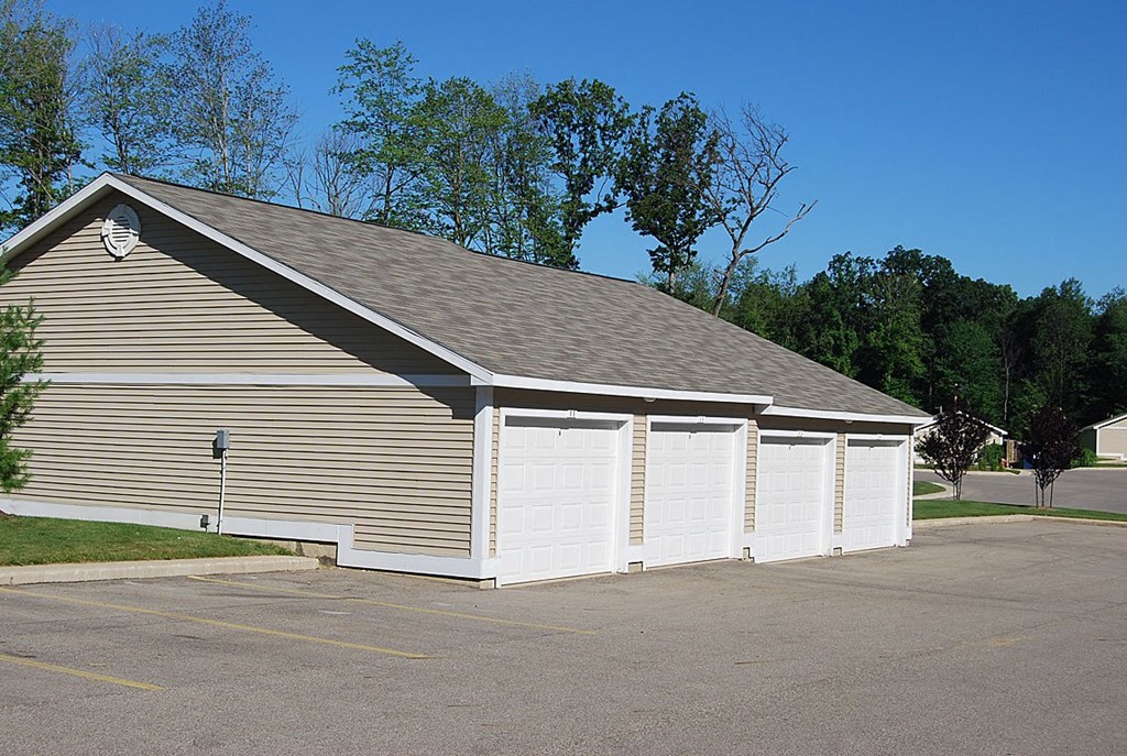 Detached Garages with Remote Openers at Trillium Pointe Apartment Homes, Jackson