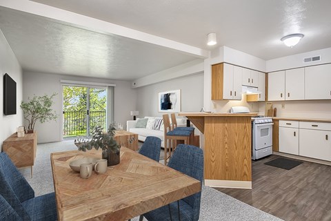 A modern kitchen with a dining table and chairs.