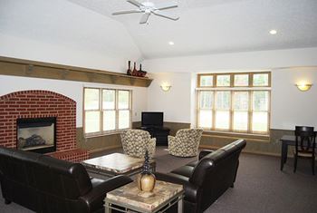 Community Clubhouse with Fireplace Seating at Trillium Pointe Apartment Homes, Jackson, MI 49201
