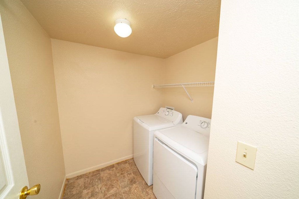 Separate Laundry Room at Trillium Pointe Apartment Homes in Jackson, MI