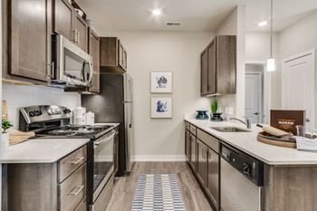 our apartments offer a modern kitchen with stainless steel appliances at 24 at Bloomfield, Bloomfield Township, MI