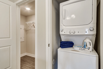 a washer and dryer in a laundry room at 24 at Bloomfield, Bloomfield Township
