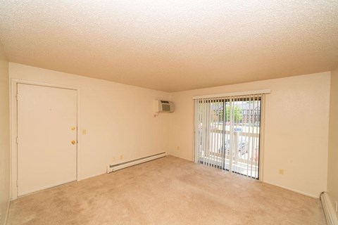 Living Room Leads to Private Balcony at Waverly Park Apartments, Michigan, 48911
