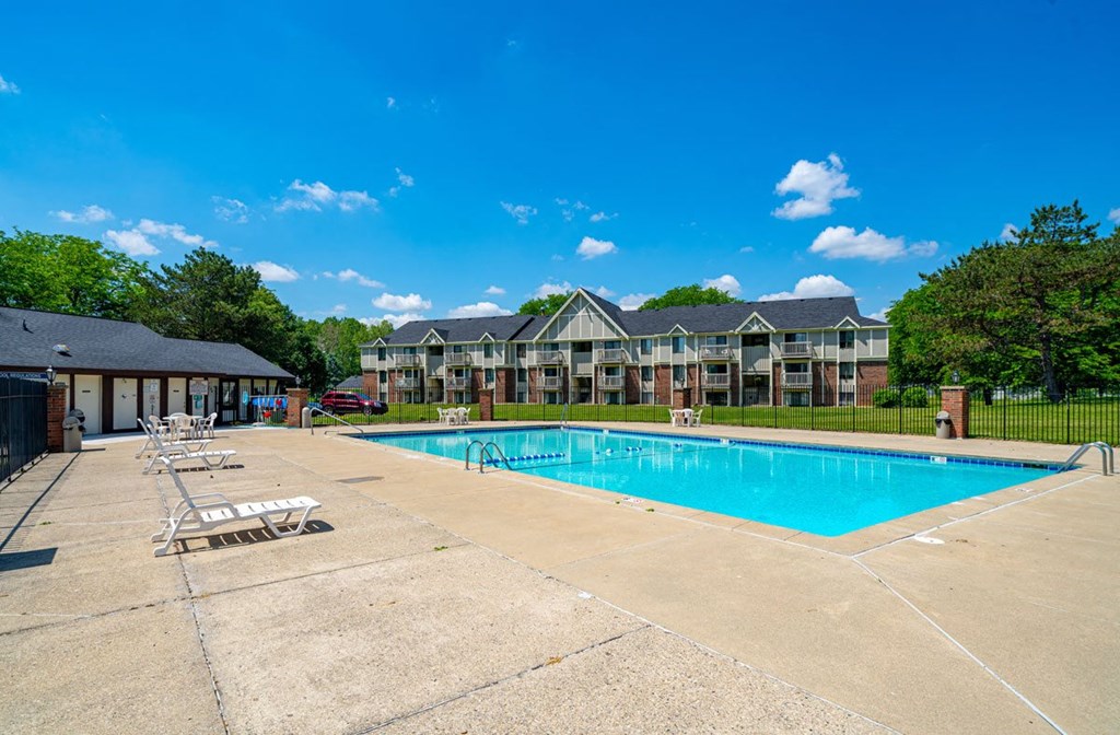 Lounge Chairs on Sundeck by Large Pool at Waverly Park Apartments, Lansing