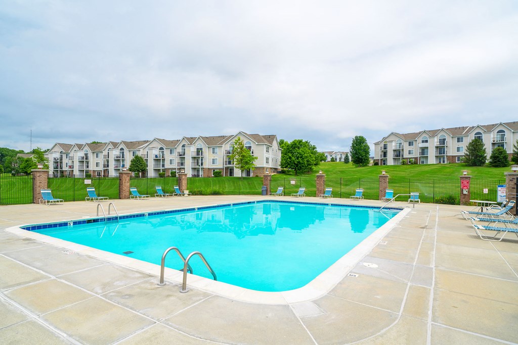 Outdoor Pool with Lounge Chairs at West Hampton Park Apartment Homes, Elkhorn, 68022