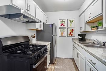 An upgraded kitchen with a gas stove at Wingate Apartments, Michigan, 49512