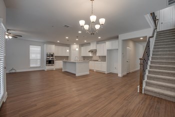 Living Area With Staircase Living Area With Staircase at Cottages at The Realm, Texas - Photo Gallery 3