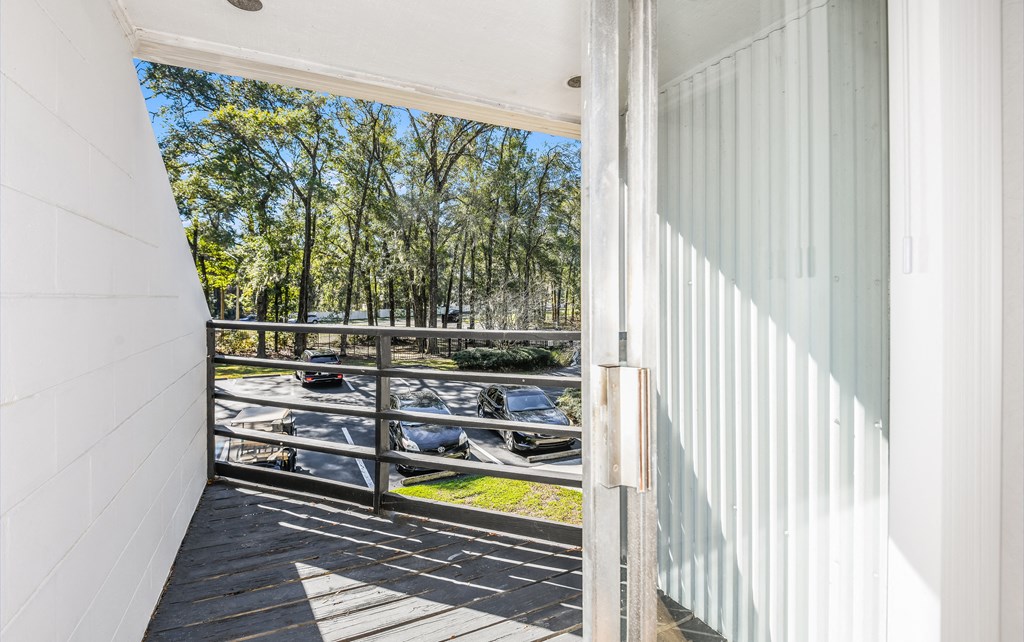 the view of the water from the balcony of a house